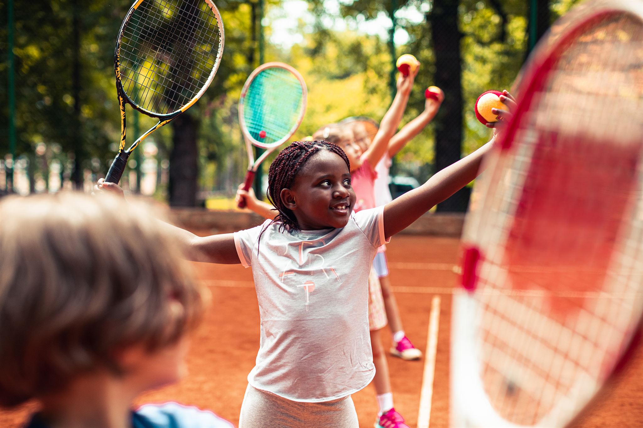 Children-taking-tennis-lesson